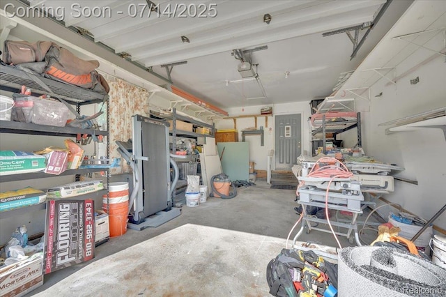 3117 Maumee Trl, Clyde, MI 48049 - garage featuring a garage door opener