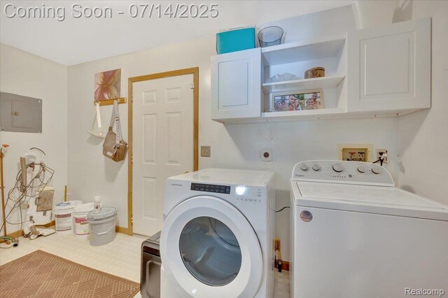 3117 Maumee Trl, Clyde, MI 48049 - laundry area with cabinet space, electric panel, washer and dryer, and tile patterned floors