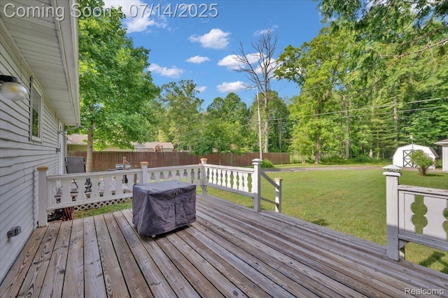 3117 Maumee Trl, Clyde, MI 48049 - wooden deck featuring a fenced backyard, a storage shed, and view of wooded area