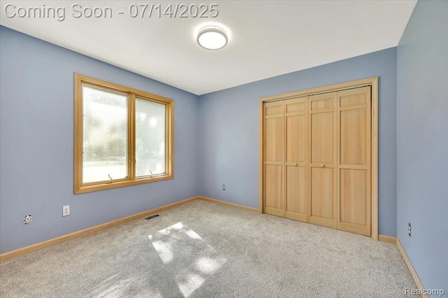 3117 Maumee Trl, Clyde, MI 48049 - unfurnished bedroom featuring carpet and a closet