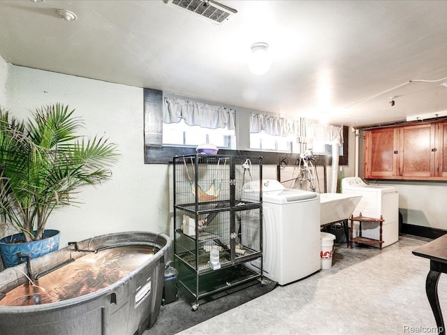 1313 Wall St, Port Huron, MI 48060 - laundry room featuring washer and clothes dryer and cabinet space