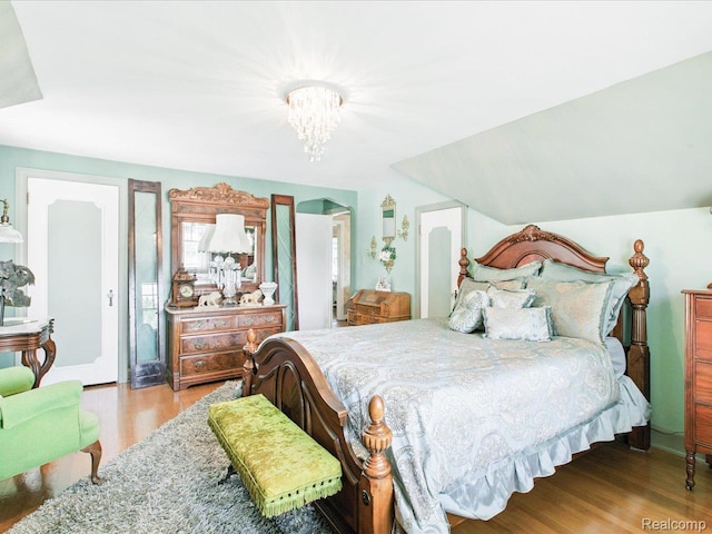 1313 Wall St, Port Huron, MI 48060 - bedroom with wood finished floors and a chandelier