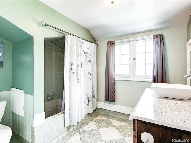 1313 Wall St, Port Huron, MI 48060 - bathroom featuring vanity, a tile shower, and vaulted ceiling