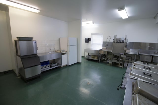 3125 W Michigan Ave, Kalamazoo, MI 49006 - garage featuring freestanding refrigerator