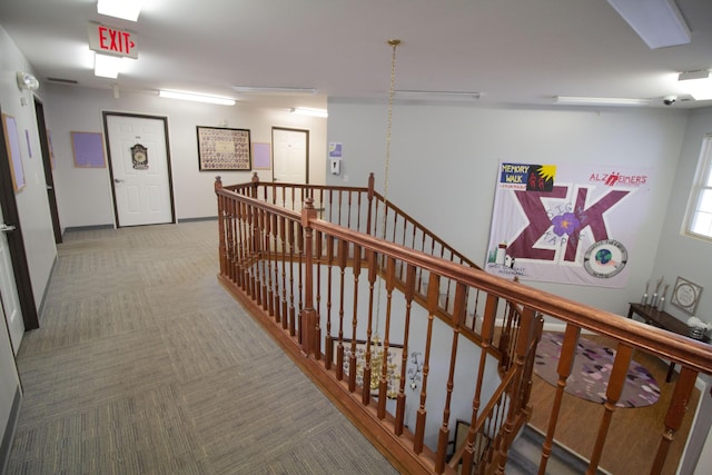 3125 W Michigan Ave, Kalamazoo, MI 49006 - hall with carpet flooring and an upstairs landing