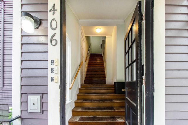 936 W Kalamazoo Ave, Kalamazoo, MI 49007 - stairway featuring crown molding and wood finished floors