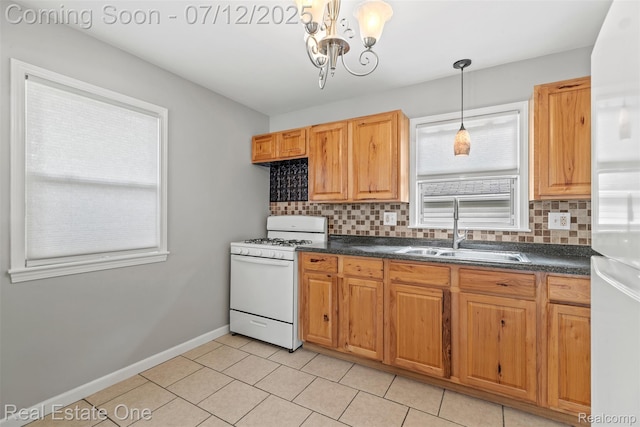 14268 Trenton Rd, Southgate, MI 48195 - kitchen with white appliances, dark countertops, tasteful backsplash, a chandelier, and light tile patterned floors