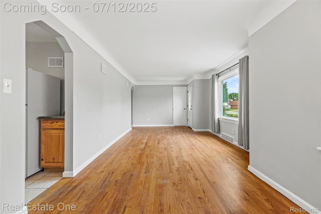14268 Trenton Rd, Southgate, MI 48195 - spare room with light wood finished floors and arched walkways