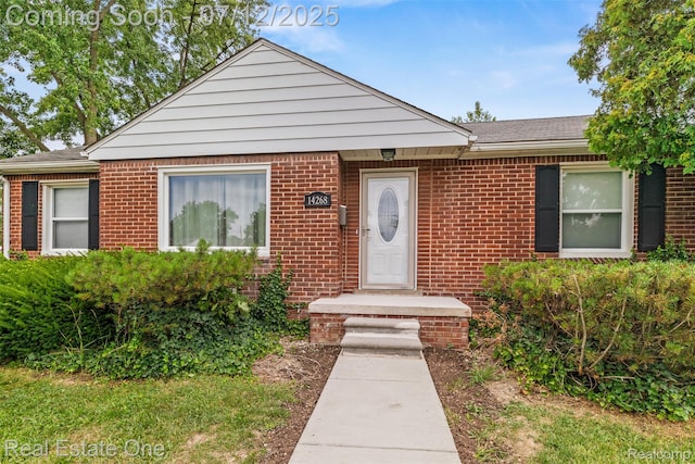 14268 Trenton Rd, Southgate, MI 48195 - view of front facade featuring brick siding and roof with shingles