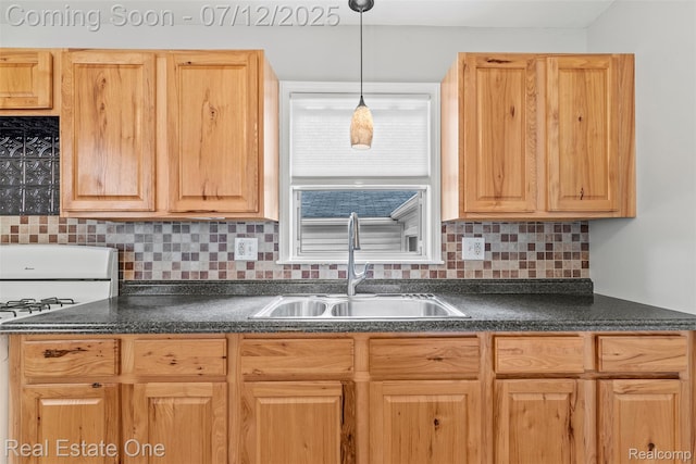 14268 Trenton Rd, Southgate, MI 48195 - kitchen featuring white range with gas stovetop, dark countertops, tasteful backsplash, and hanging light fixtures