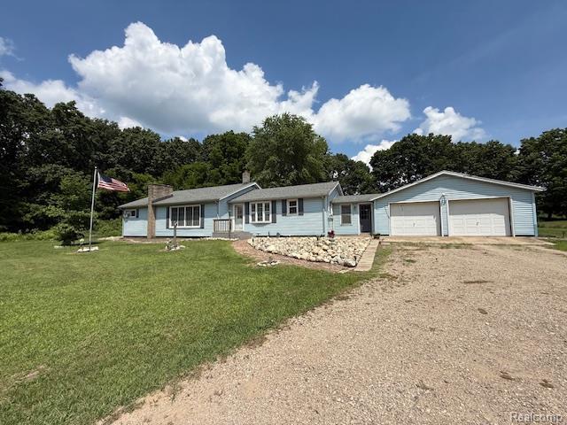 3103 Roush Rd, Hastings, MI 49058 - ranch-style house with dirt driveway, a front yard, and a garage