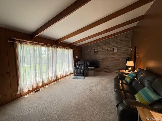 3103 Roush Rd, Hastings, MI 49058 - living area with carpet flooring and a fireplace with raised hearth