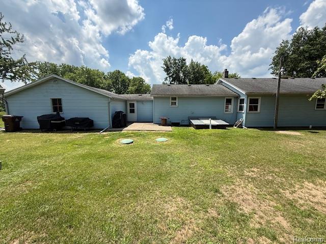 3103 Roush Rd, Hastings, MI 49058 - rear view of property with a yard and a patio