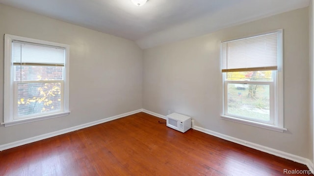 10800 Stratman St, Detroit, MI 48224 - empty room with wood finished floors and vaulted ceiling