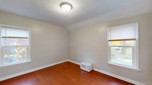 10800 Stratman St, Detroit, MI 48224 - spare room featuring dark wood finished floors and lofted ceiling