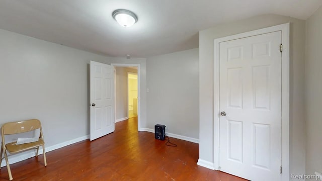 10800 Stratman St, Detroit, MI 48224 - unfurnished bedroom with wood finished floors and baseboards