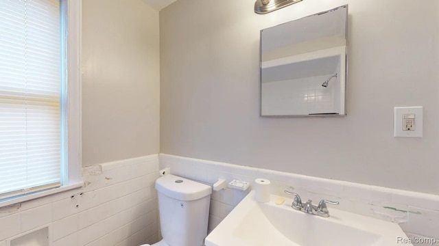 10800 Stratman St, Detroit, MI 48224 - bathroom with tile walls, a wainscoted wall, and vanity