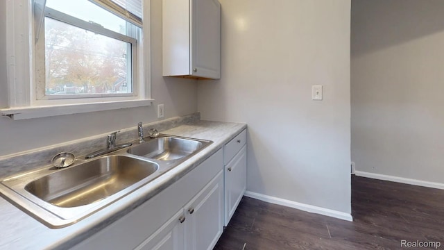 10800 Stratman St, Detroit, MI 48224 - kitchen with dark wood finished floors, white cabinetry, and light countertops