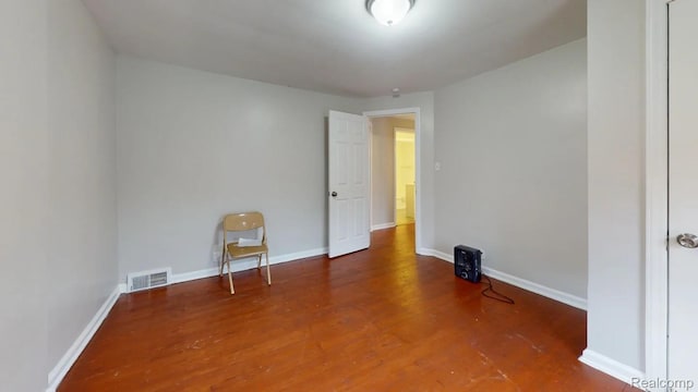10800 Stratman St, Detroit, MI 48224 - spare room featuring wood finished floors and baseboards