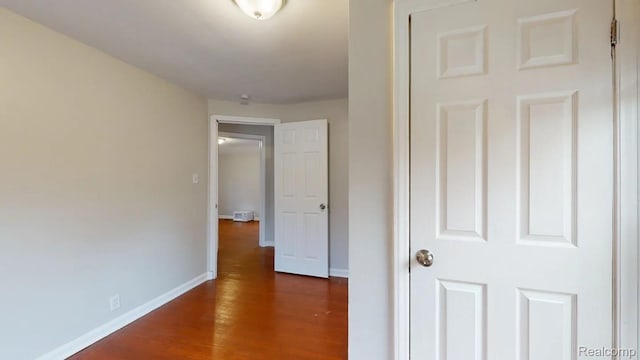 10800 Stratman St, Detroit, MI 48224 - hall with baseboards and wood finished floors