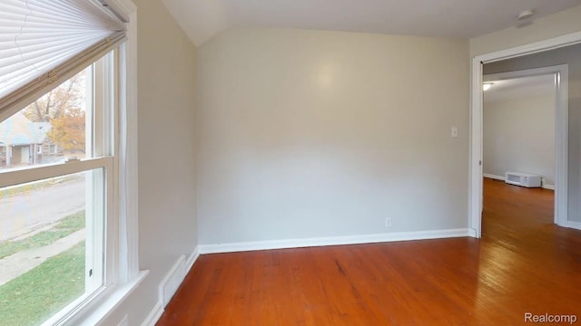 10800 Stratman St, Detroit, MI 48224 - unfurnished room featuring wood finished floors and lofted ceiling