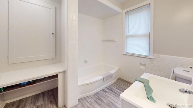 10800 Stratman St, Detroit, MI 48224 - full bathroom featuring wood finished floors and a wainscoted wall