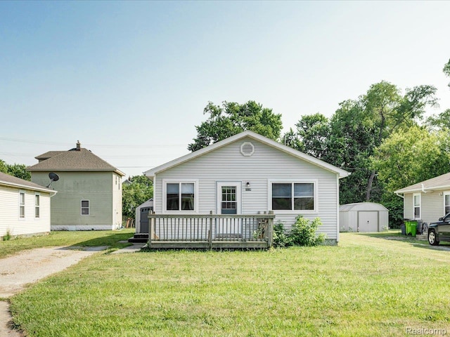 1114 Union St, Port Huron, MI 48060 - view of front facade with a shed, a front yard, and a wooden deck