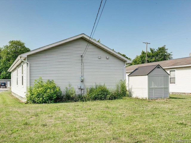 1114 Union St, Port Huron, MI 48060 - view of side of property with a shed and a lawn