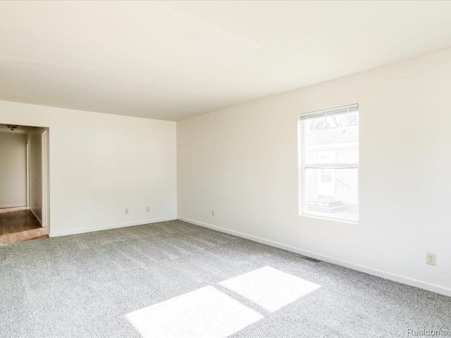 1114 Union St, Port Huron, MI 48060 - carpeted empty room featuring baseboards