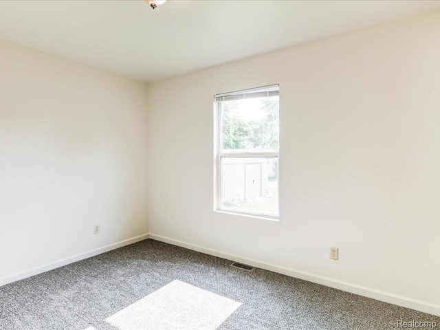 1114 Union St, Port Huron, MI 48060 - carpeted empty room featuring baseboards