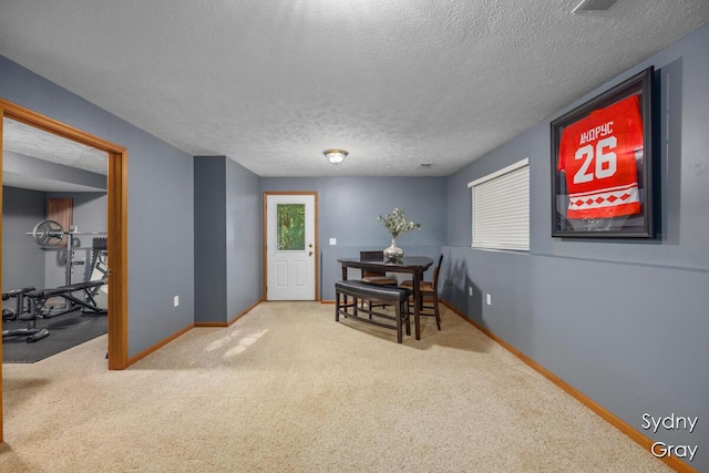 11200 Ivory Valley Dr NE, Rockford, MI 49341 - dining room with a textured ceiling and carpet floors