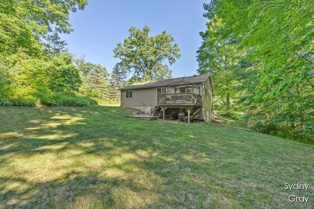 11200 Ivory Valley Dr NE, Rockford, MI 49341 - view of grassy yard with a wooden deck and stairs