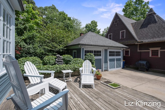 120 Union Ave SE, Grand Rapids, MI 49503 - deck with a grill, an outbuilding, a detached garage, and a patio