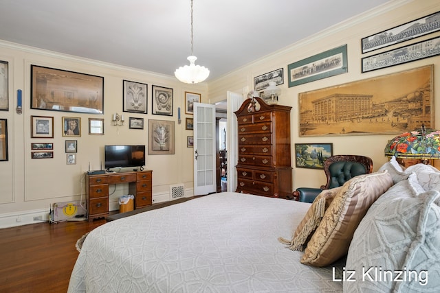 120 Union Ave SE, Grand Rapids, MI 49503 - bedroom featuring ornamental molding, wood finished floors, and a chandelier