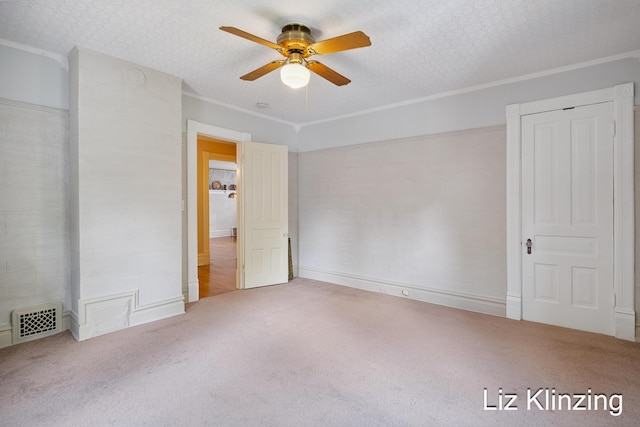 120 Union Ave SE, Grand Rapids, MI 49503 - unfurnished bedroom with carpet floors, ornamental molding, and ceiling fan