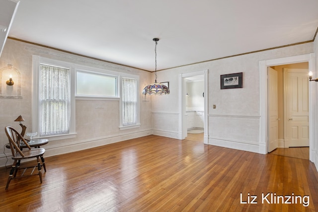 120 Union Ave SE, Grand Rapids, MI 49503 - unfurnished dining area with hardwood / wood-style flooring and ornamental molding