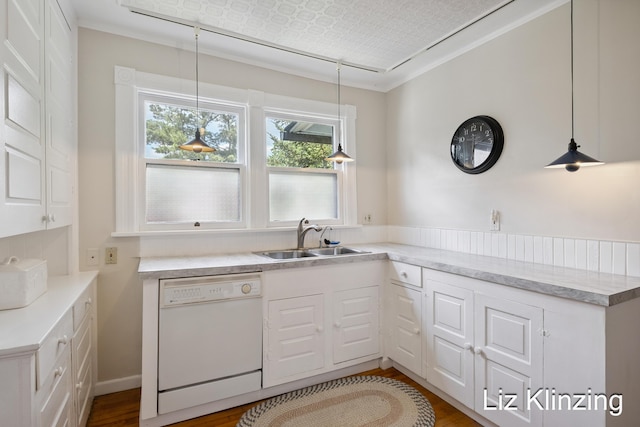 120 Union Ave SE, Grand Rapids, MI 49503 - kitchen with white dishwasher, white cabinetry, wood finished floors, and light countertops