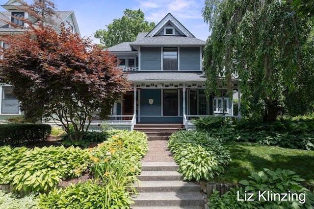 120 Union Ave SE, Grand Rapids, MI 49503 - victorian home featuring a porch and a shingled roof