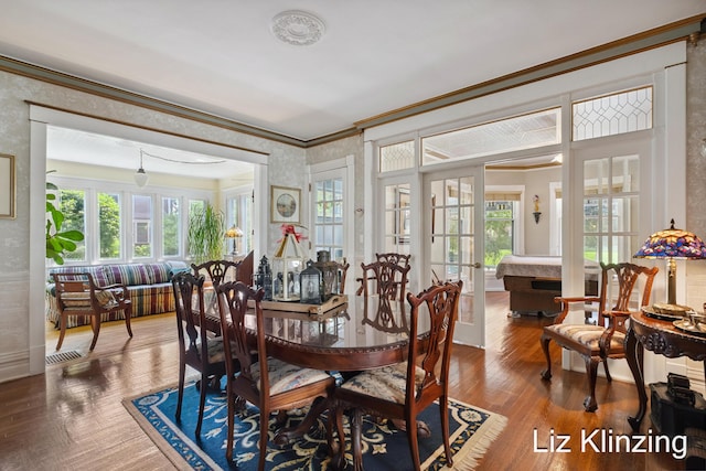 120 Union Ave SE, Grand Rapids, MI 49503 - dining room with crown molding, wallpapered walls, wood finished floors, and french doors