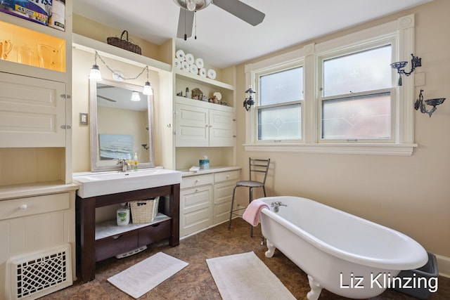120 Union Ave SE, Grand Rapids, MI 49503 - full bath featuring a freestanding tub, a ceiling fan, and vanity