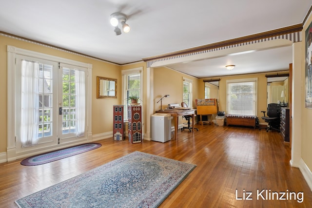 120 Union Ave SE, Grand Rapids, MI 49503 - living area with healthy amount of natural light, crown molding, wood finished floors, and an office area
