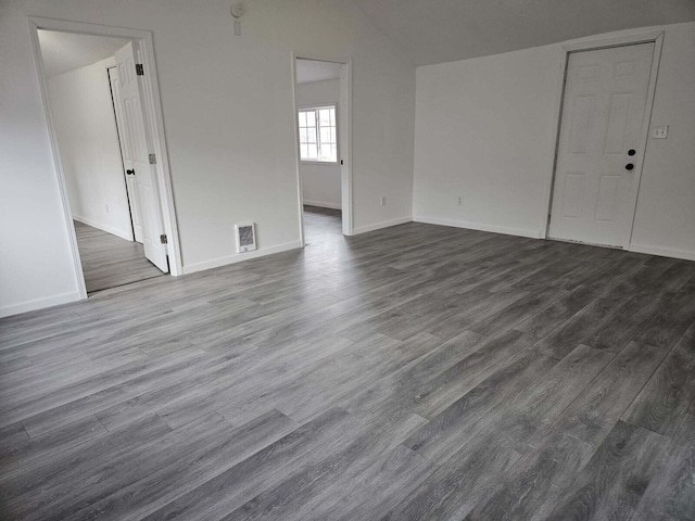 538 Whitney Ave, Morenci, MI 49256 - empty room featuring lofted ceiling and dark wood-style flooring