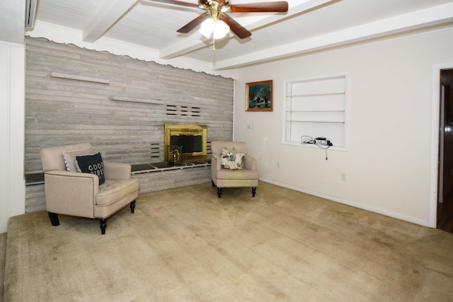 2357 River St, Kalamazoo, MI 49048 - sitting room with a ceiling fan, beamed ceiling, a stone fireplace, wood walls, and carpet