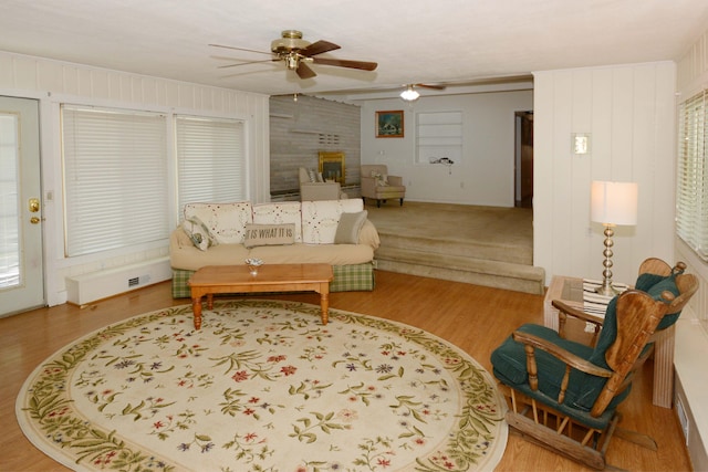 2357 River St, Kalamazoo, MI 49048 - living area with a ceiling fan, wood finished floors, and a brick fireplace