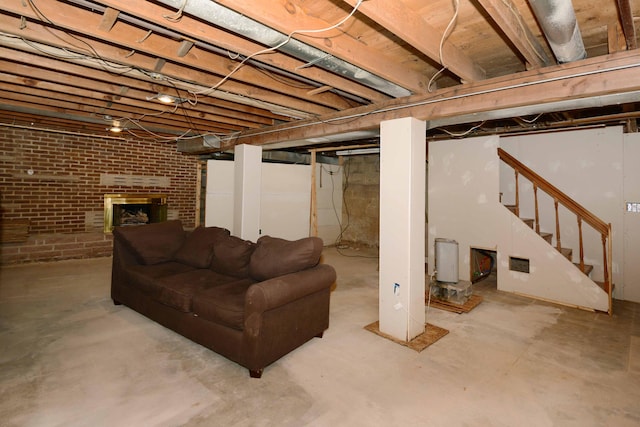2357 River St, Kalamazoo, MI 49048 - below grade area featuring brick wall, stairs, and a fireplace
