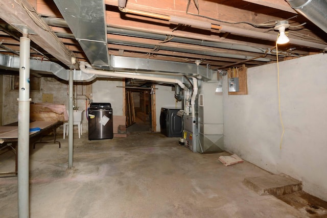 2357 River St, Kalamazoo, MI 49048 - unfinished basement featuring washer and dryer, heating unit, and a water softener system