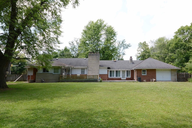 2357 River St, Kalamazoo, MI 49048 - view of front of property featuring brick siding, an attached garage, and a chimney