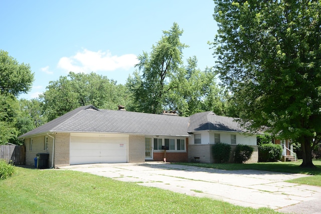 2357 River St, Kalamazoo, MI 49048 - ranch-style home with brick siding, a garage, a front yard, and concrete driveway