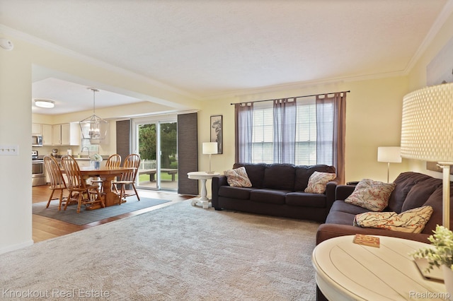 622 W Schleier St, Frankenmuth, MI 48734 - living room with ornamental molding, wood finished floors, and a chandelier