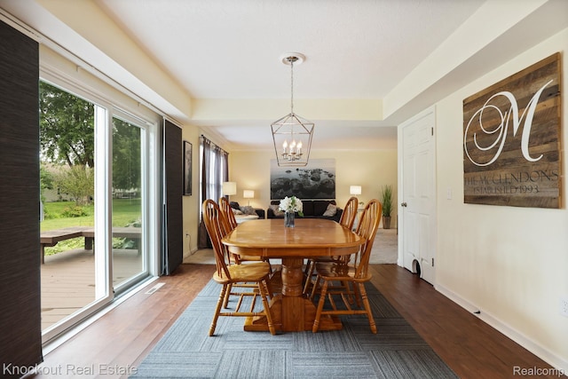 622 W Schleier St, Frankenmuth, MI 48734 - dining area with a chandelier and wood finished floors